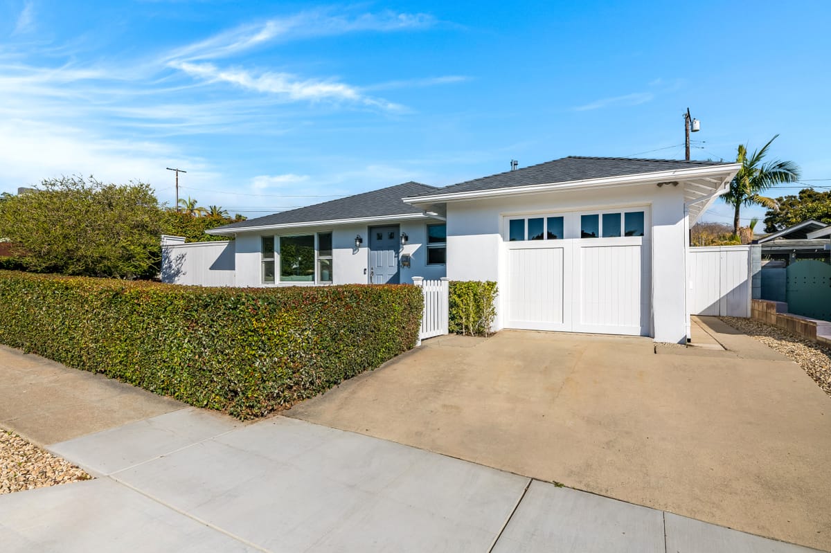 Street-facing elevation with new garage door