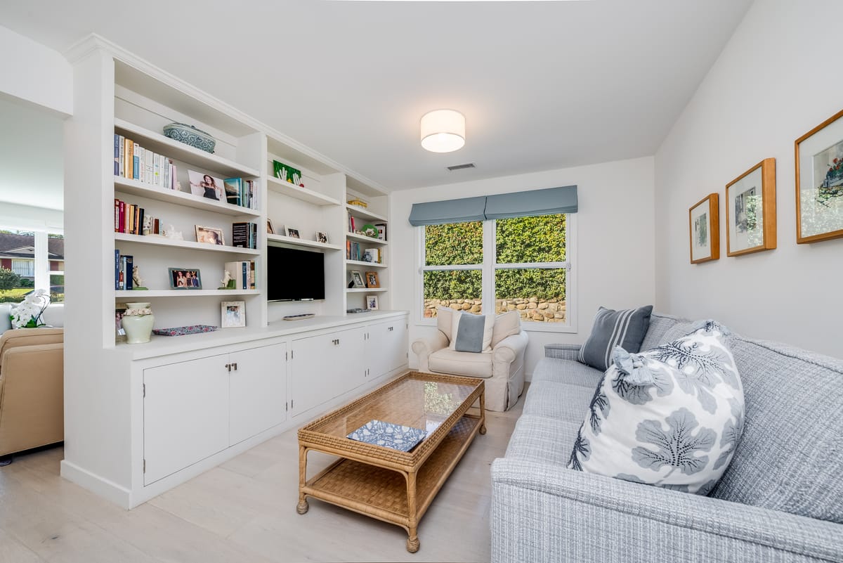 Cozy family room with built-in bookshelves and a window seat